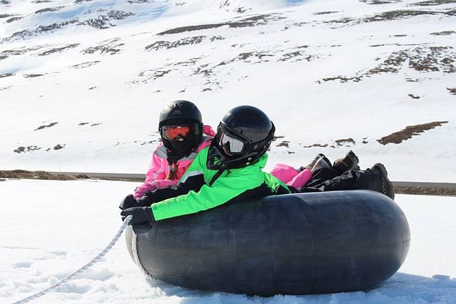 Snowmobile and slide Family tour
