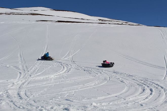 Snowmobile and slide Family tour