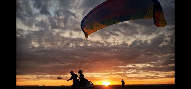 Tandem Paragliding over the Rugged Lava Fields at Blue Mountains
